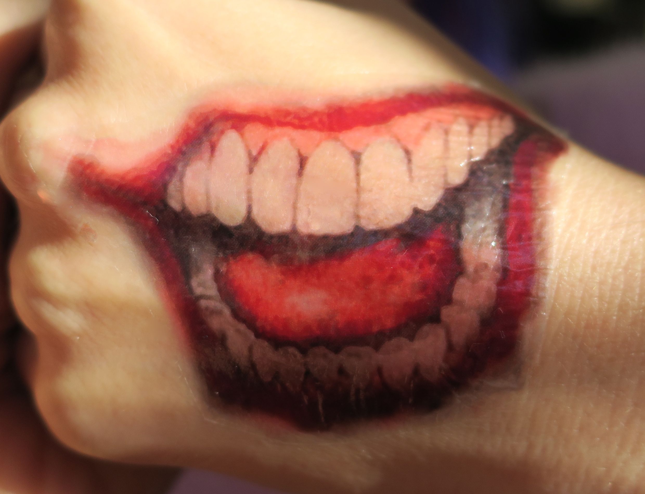 Joker Mouth Hand Tattoo: Bold Trend & Meaning Explained